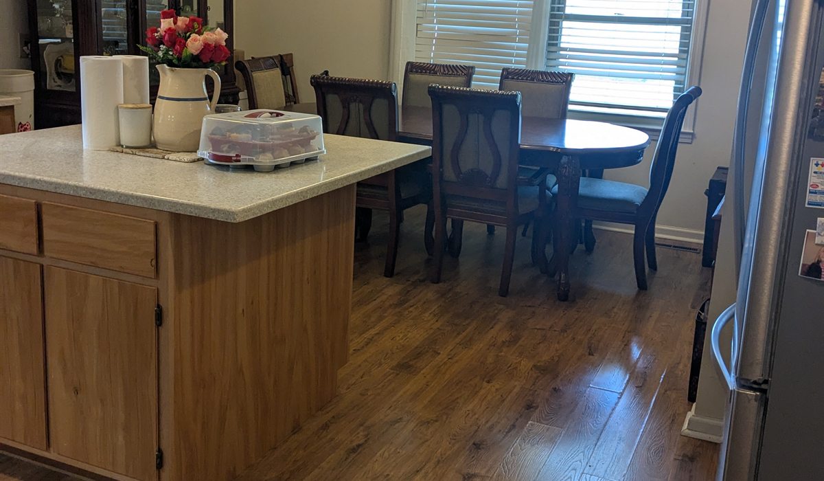 Rental apartment kitchen and dining area after reset cleaning